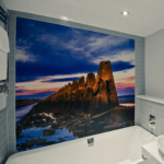 Superior room bathroom with photographic mural on wall behind bath