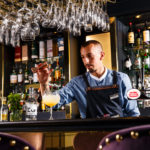 Bartender mixing cocktails at the Princes Street Bar inside Mercure Edinburgh City Princes Street Hotel.