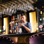 Bartender mixing cocktails at the Princes Street Bar inside Mercure Edinburgh City Princes Street Hotel.