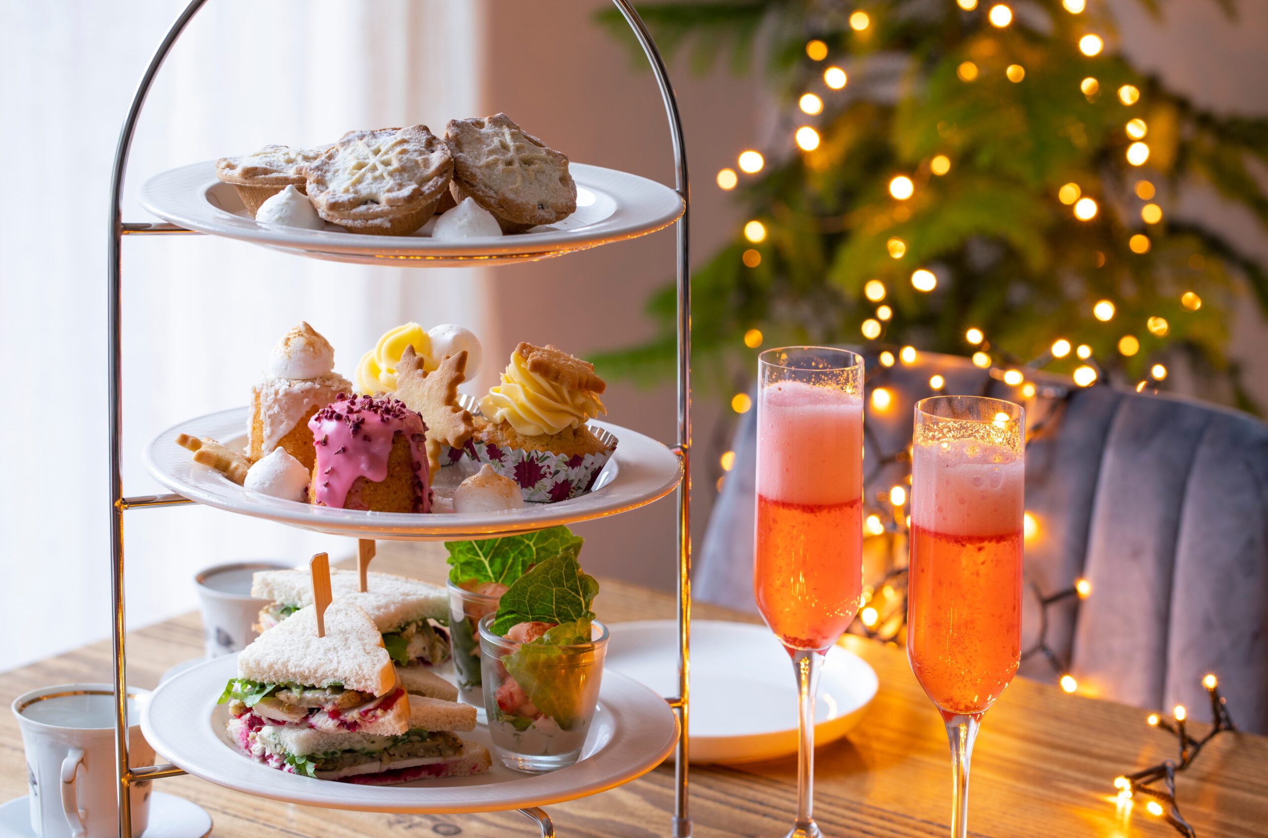 Christmas,Afternoon,Tea,With,Mince,Pies,,Cakes,,Turkey,Sandwiches,And table filled with festive food